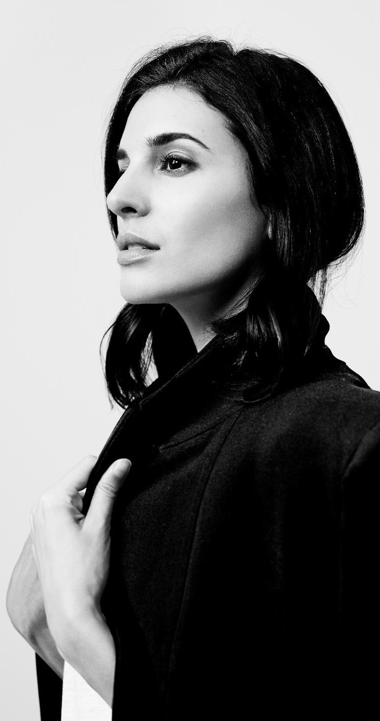 Black and white portrait of a woman with a contemplative expression