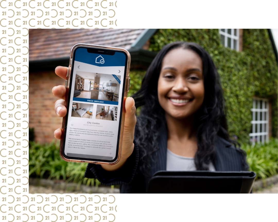 Real estate agent showing a property listing on a smartphone, representing CENTURY 21 Triangle Group's use of modern technology in real estate.