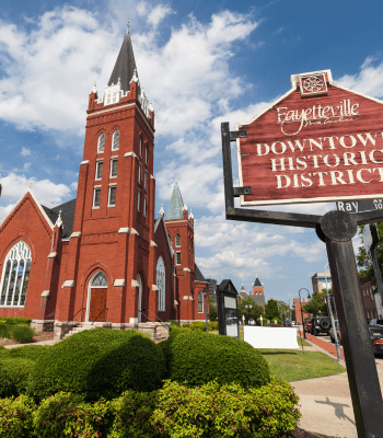 Fayetteville Downtown Historic District with red-brick buildings and a church.