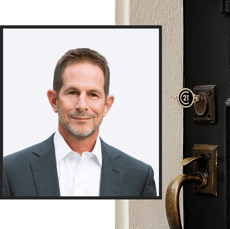 Portrait of Stephen Votino, CEO of Century 21 Triangle Group, next to a door lock with a Century 21 branded key inserted.